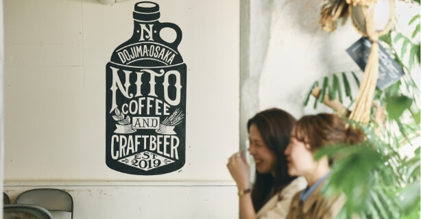 @NITO COFFEE AND CRAFT BEER̕ǂɕ`ĂXgATC̎ʐ^